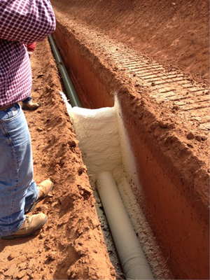 Installing spray foam trench breakers in Calgary area AB
